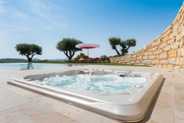 Hydropool Signature 790 Platinum sunken into the ground of garden
